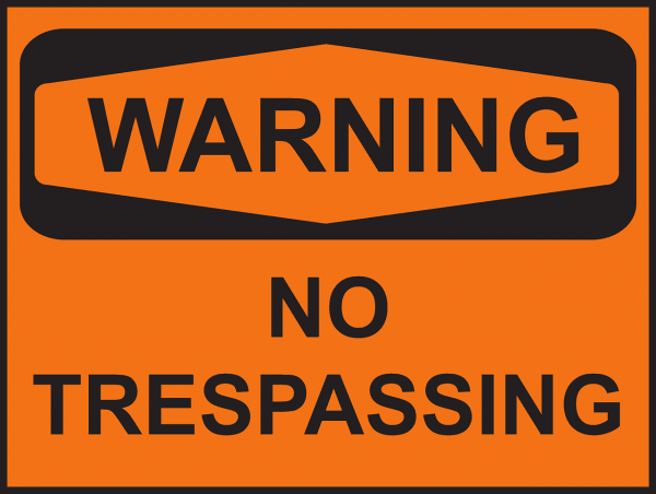 orange sign with black text that says warning, no trespassing