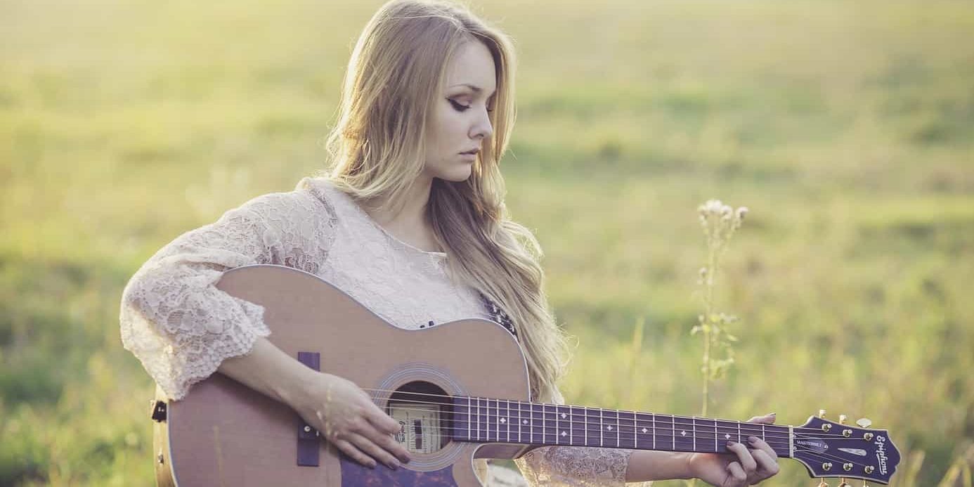 music-therapy-suicide-grief woman playing guitar