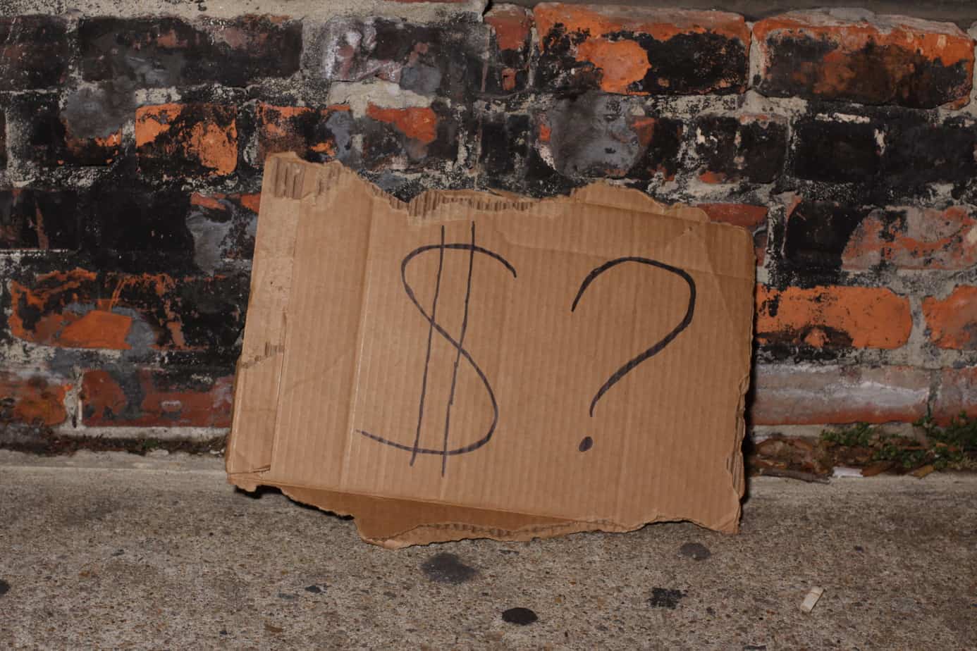 Panhandling Sign cardboard sign with a dollar and question mark symbols