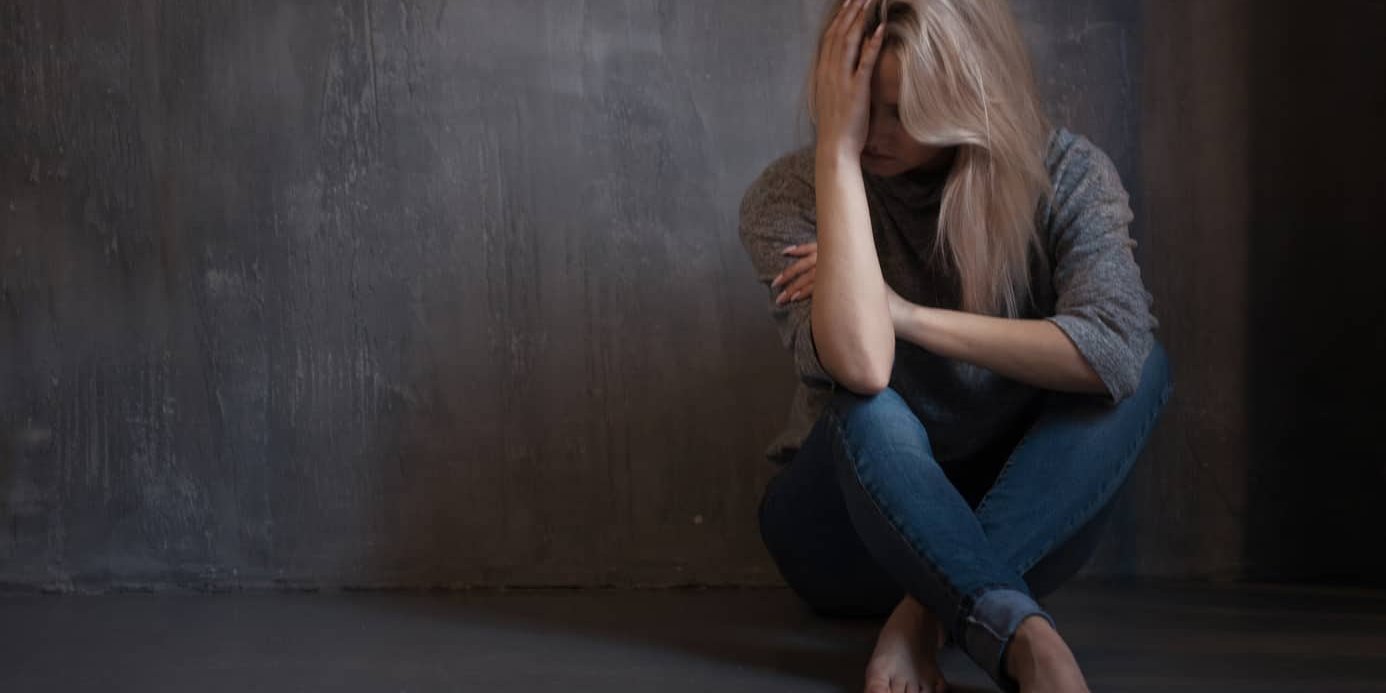 Mental health. Young woman lying on the floor young woman dealing with depression