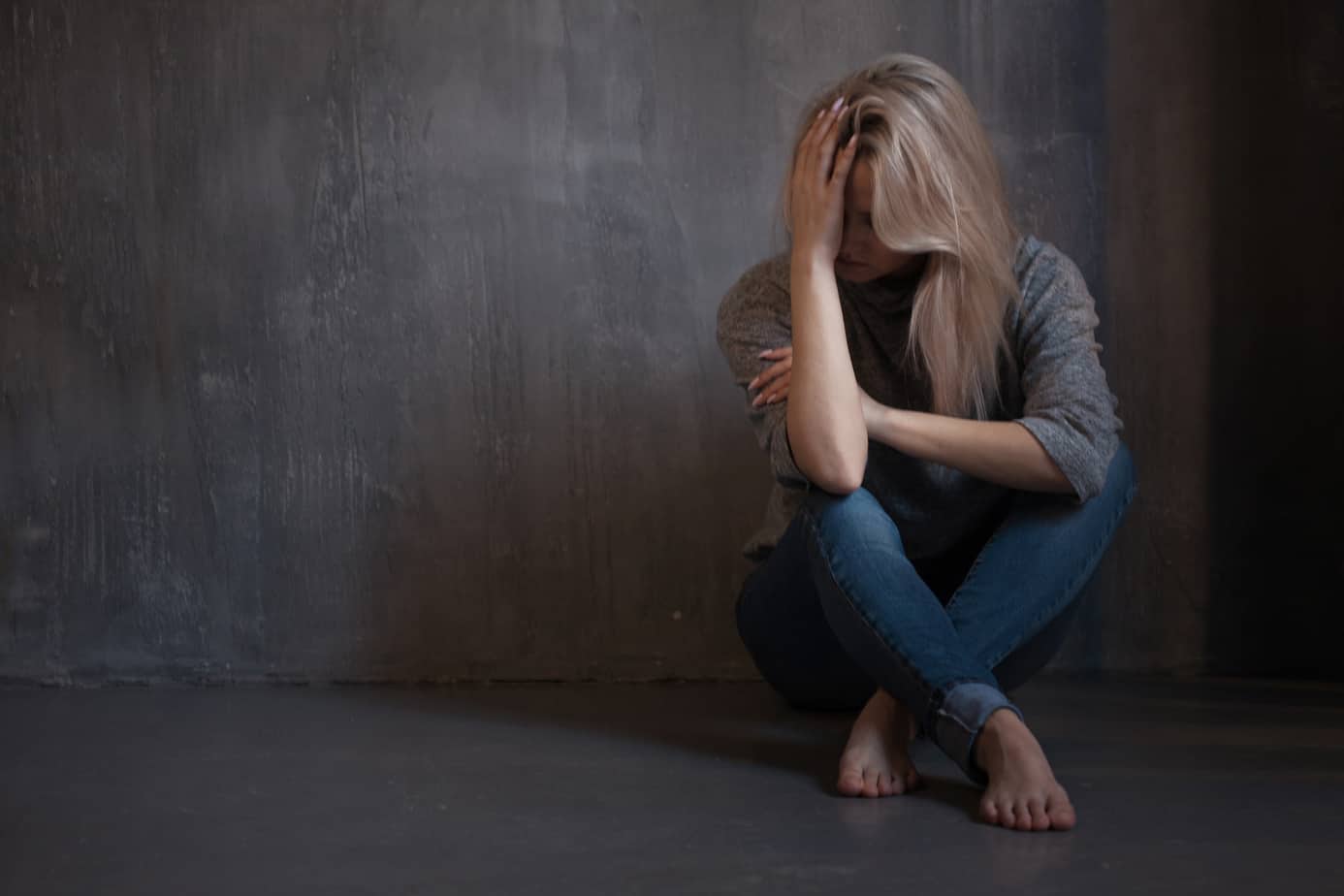 Mental health. Young woman lying on the floor young woman dealing with depression